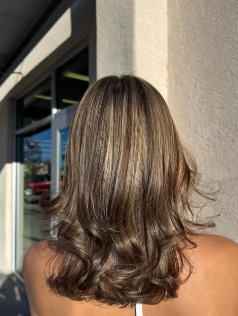 Dimensional brunette color and styling by Louriani